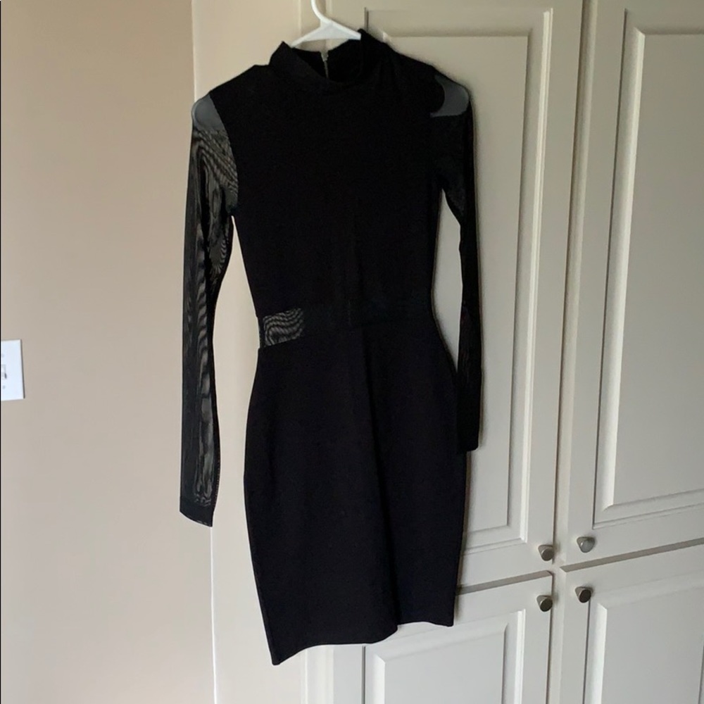 Bodycon black dress. Not too short.